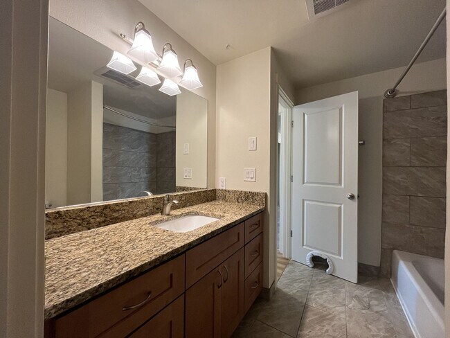 Building Photo - Bright and Airy Home with Stainless Steel Kitchen, Vaulted Ceilings & Washer + Dryer