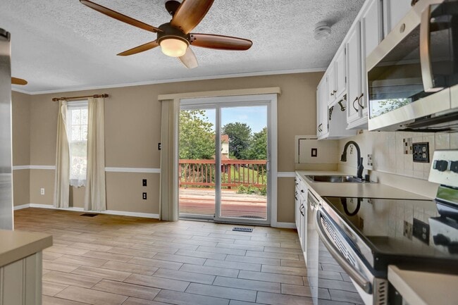 Building Photo - Spacious 4-Level Home with Deck, Workshop ...