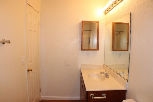 Building Photo - $250 OFF! Charming Two-Story Condo in Palm...