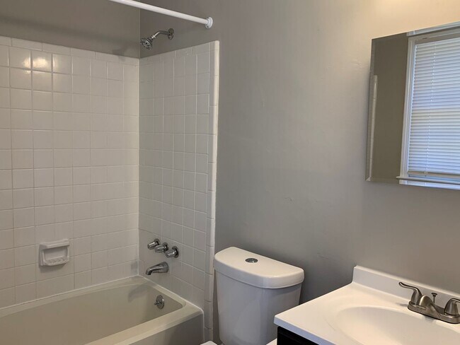 Building Photo - SW Large Brick Home, Updated Kitchen & Bathrooms, Wood Like Flooring, Fenced Yard!