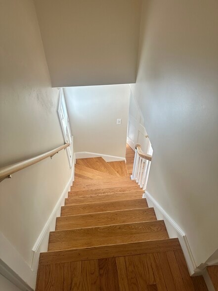 New hardwood on the stairs with handles for your safety - 324 Elm St