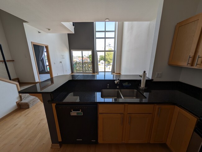 View of the kitchen looking out to the living room - 2121 S Kinnickinnic Ave