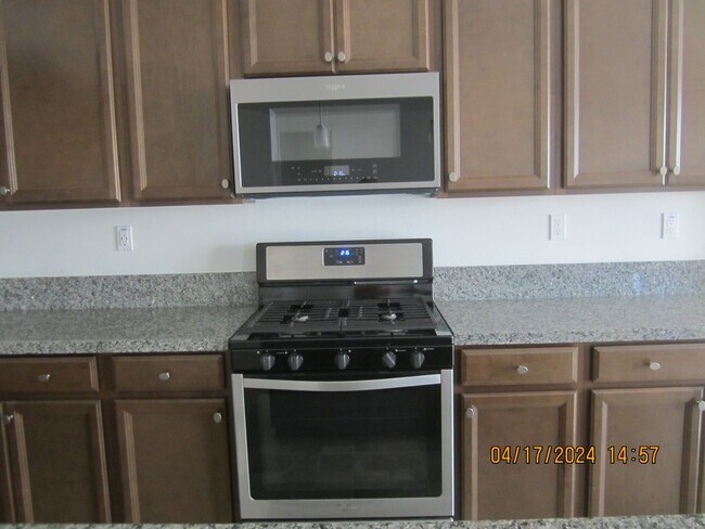 Building Photo - COOL POOL, PARKS AND NEAR NEW 3 BR PLUS DEN IN MEINFEE