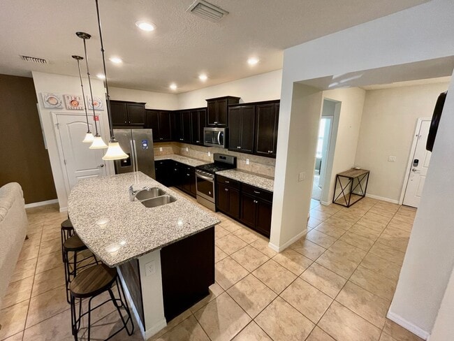 Building Photo - Spacious 5-Bed / 4.5-Bath Townhome w/ Private Pool & Sundeck in Gated Oakmont at Solterra Near Di...