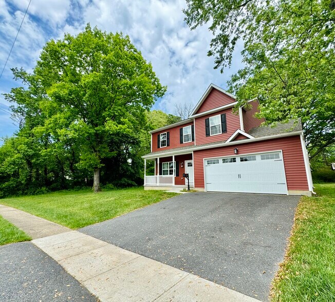 Two-car garage and extra driveway parking. - 2321 Farrand Dr