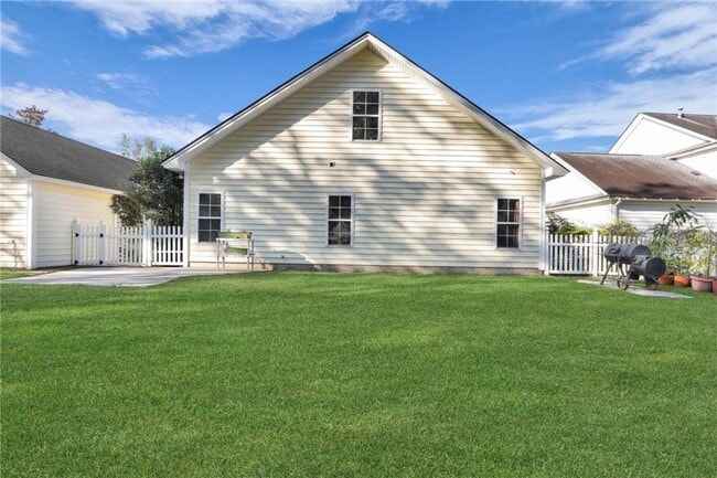 Building Photo - 4-Bedroom Home in Wild Heron with Front Porch and Fenced Yard