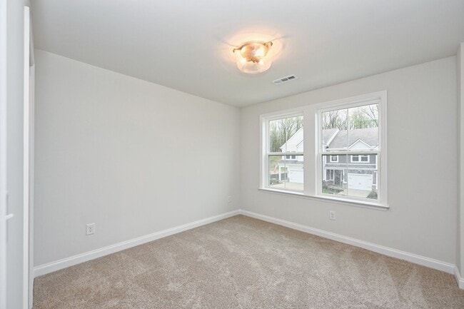Building Photo - **BE THE LUCKY ONE TO LIVE IN THIS 2024-BUILT TOWNHOME**