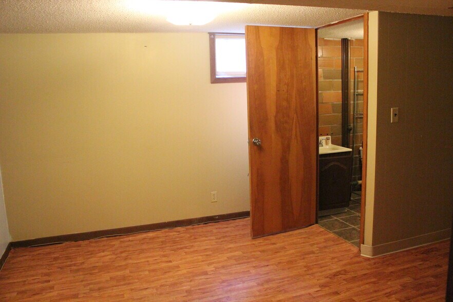 An extra room in the basement has an adjacent half bath. - 1624 elmhurst ave