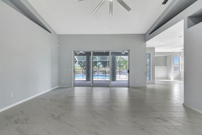 Building Photo - A BOATER'S PARADISE WITH THIS STUNNING 3 BEDROOM, 2 BATH WATERFRONT POOL HOME W/DOCK & BOAT LIFT ...