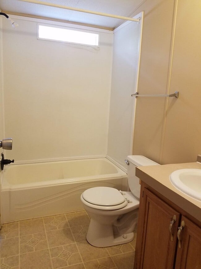 Building Photo - 3 bedroom 2 bath on 1/2 acre of land with a FENCED YARD