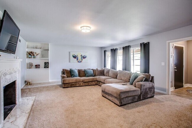 Building Photo - Spacious 4-Bedroom Home with Dual Living Areas