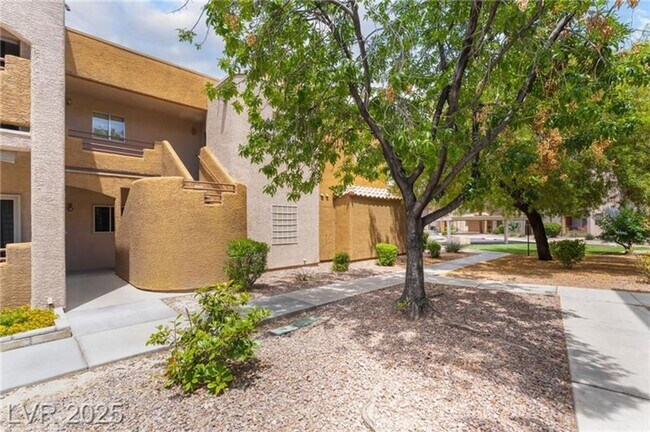 Building Photo - INVITING 2 BEDROOM TOP FLOOR CONDO IN A CE...