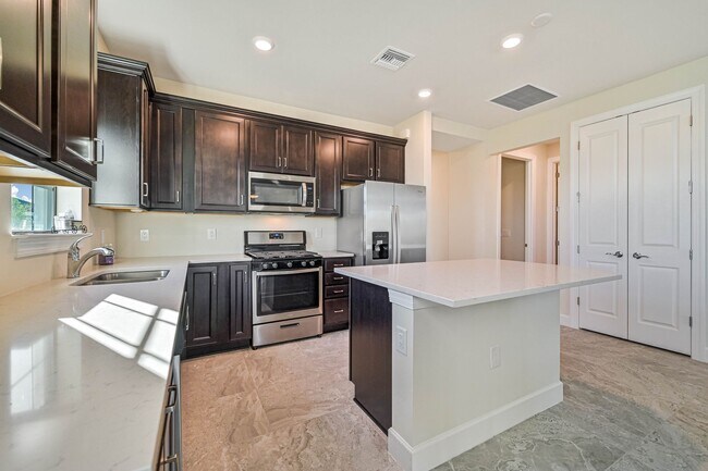 Building Photo - **Coach Home w/ Private Pool in Esplanade Lake Club **