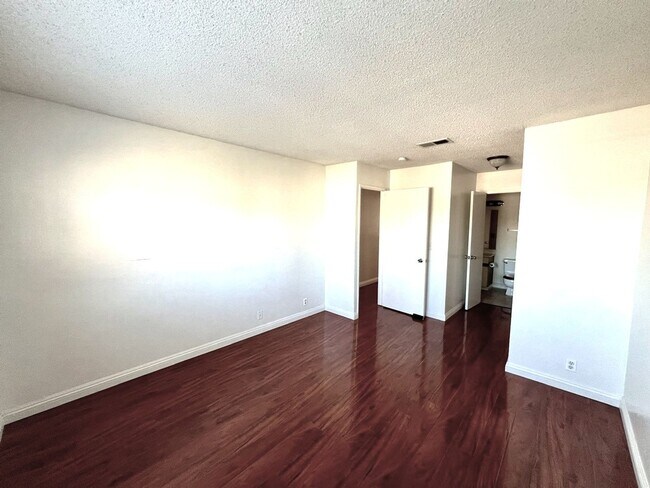 Building Photo - 2 Bedroom, 2 Bath Upstairs Condo with Private Balcony & 2-Car Garage, Gated Community, Water/Tras...