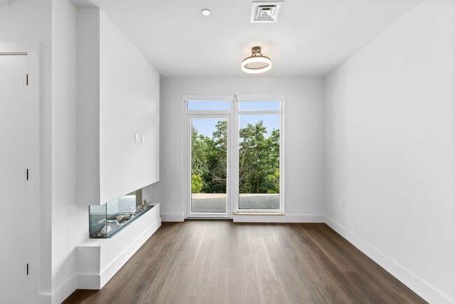 Building Photo - 2 Bedroom Corner-Unit with Wooded Balcony ...