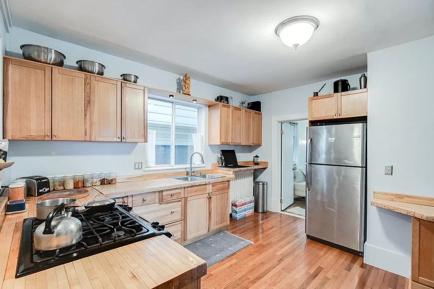 Kitchen. Countertops are reclaimed wood from Bryant Lake Bowl. - 3032 grand ave