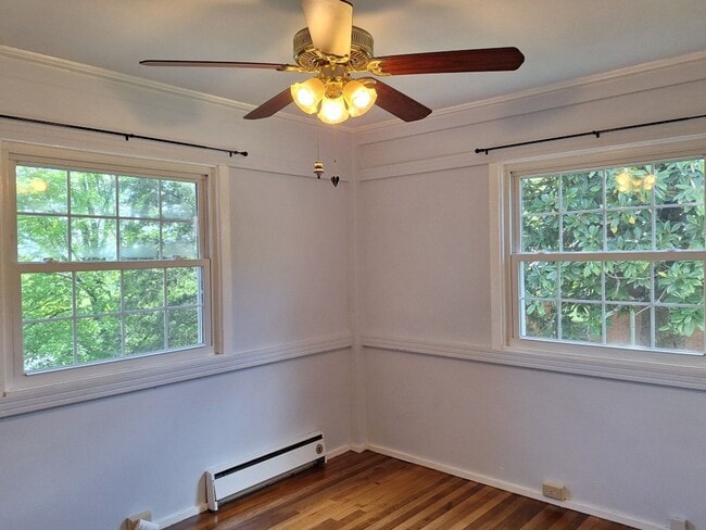 Building Photo - Cute white cottage with white picket fence & Huge deck off back door!
