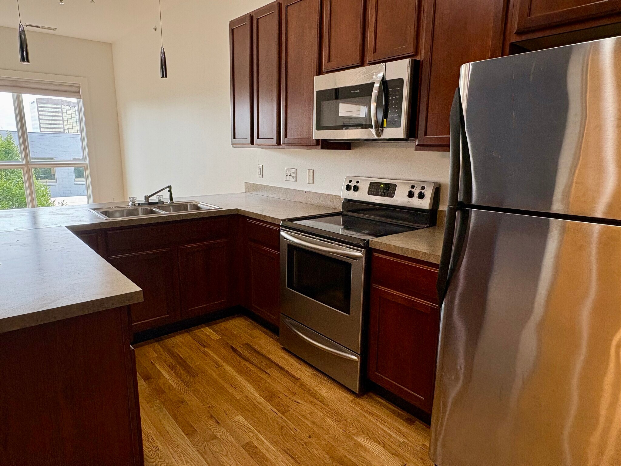 Kitchen includes dishwasher, refrigerator, oven, new microwave, garbage disposal. - 233 E Saint Joseph St