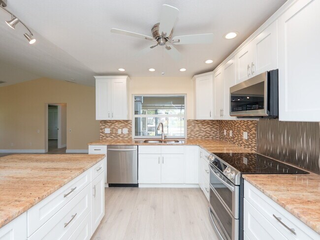 Building Photo - 3 BEDROOM • 2 BATHROOM • PRIVATE POOL • WATERFRONT • BOAT LIFT • ZERO DEPOSIT MOVE-IN AVAILABLE