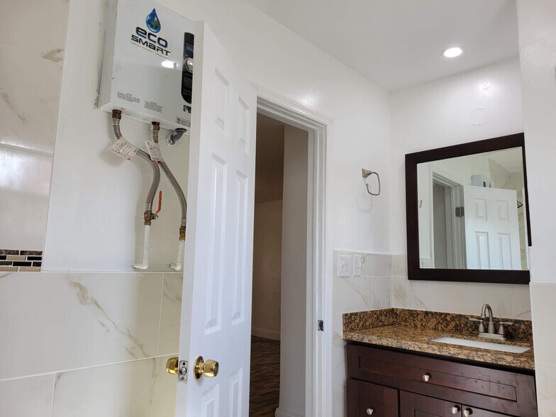 Bathroom tankless water heater - 1646 NE 150th ST