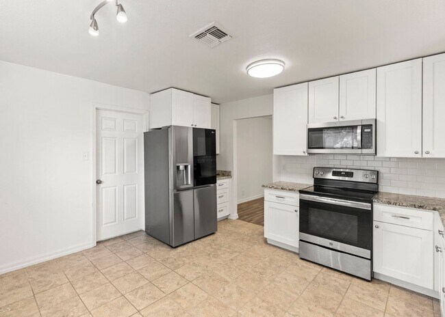 Building Photo - Move-In Ready Contemporary Gem on Treed Co...