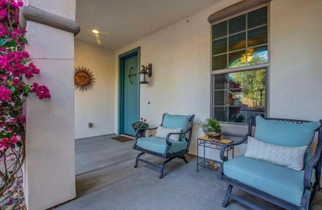 Peaceful front patio looks out to quaint courtyard entrance and quiet street. - 20892 W Eastview Way