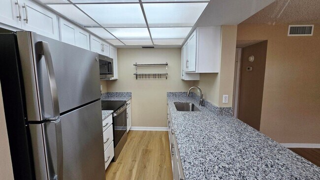 Building Photo - Annual Updated 1BR/1BA Condo – New Interior Finishes, Located on the 2nd Floor
