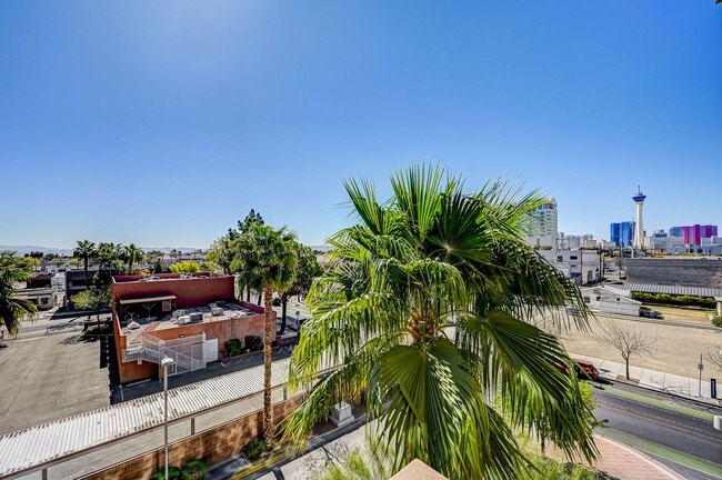 Building Photo - Fully Furnished 4th-Floor Condo with Stunn...