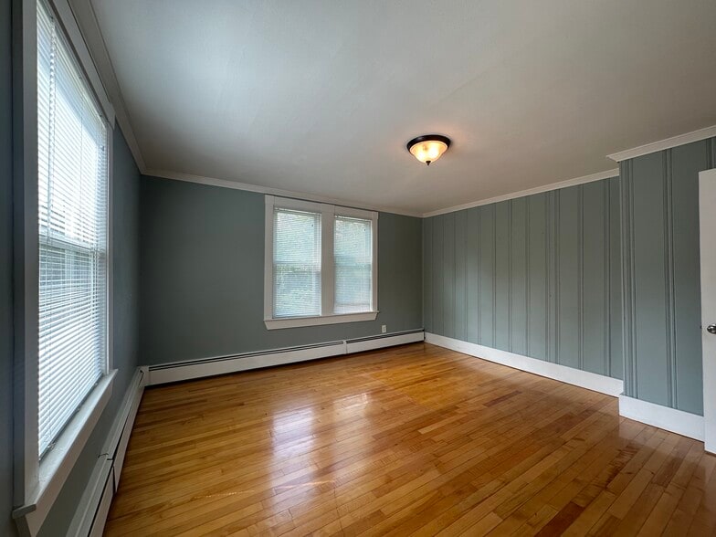 Generous primary bedroom with closet and natural light - 363 Concord Rd