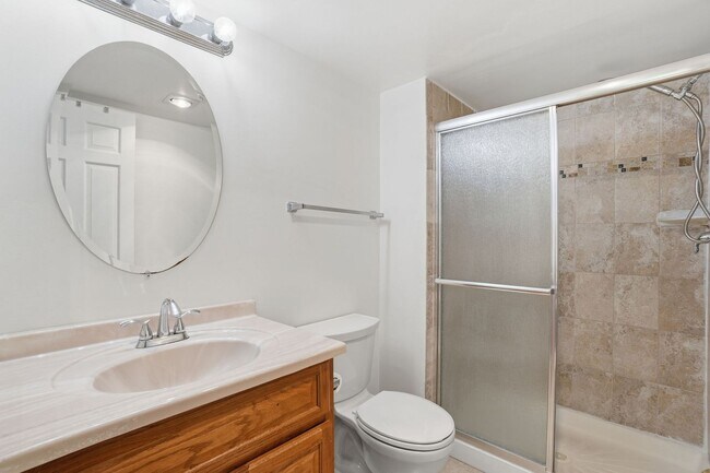 Building Photo - This expansive ground level residence is set within a serene, gated garden community surrounded b...