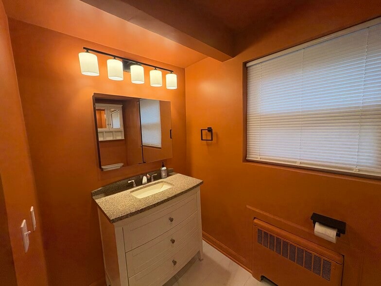 Updated vanity with granite countertop - 6035 Oakwood Ave