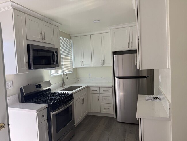 Building Photo - FOR RENT — COMPLETELY REMODELED Apartment