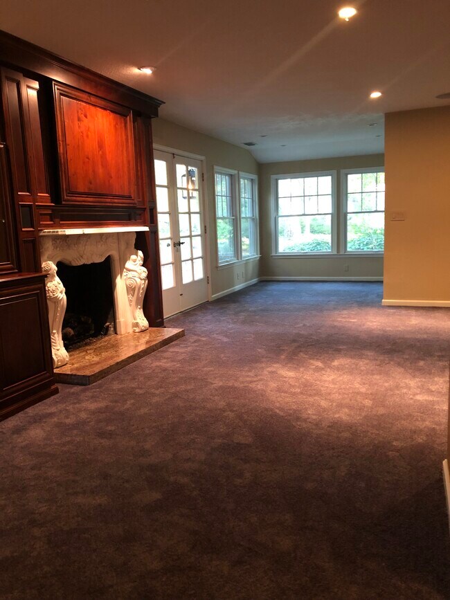 Lg open light infused living room with marble surround gas fireplace - 5930 Long Acres Ct