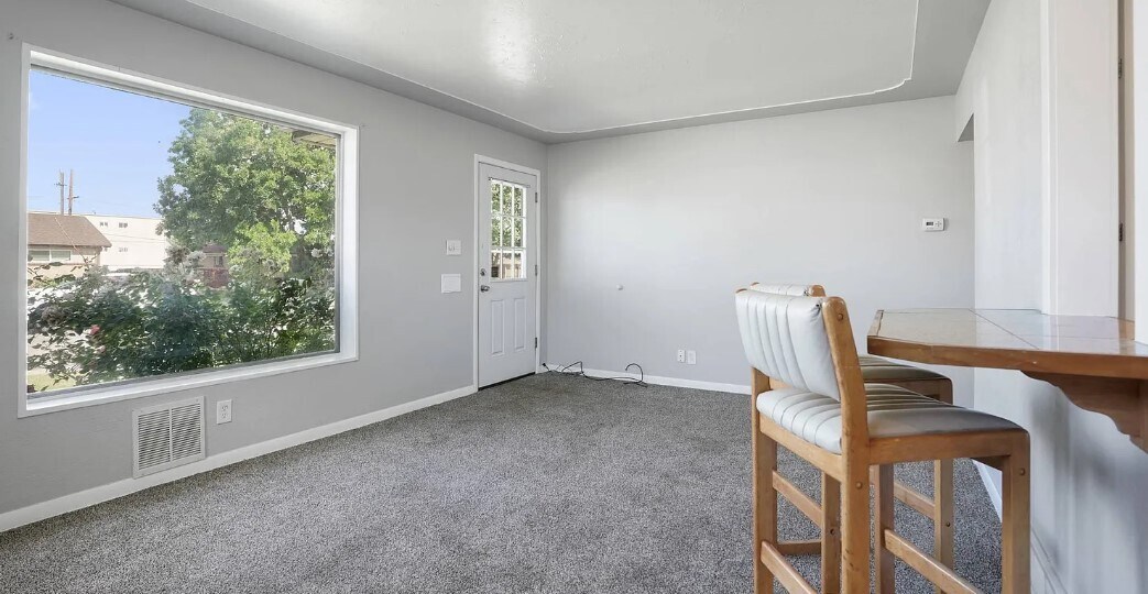Front entrance into Living Room. Hardwood floors underneath - 7141 Quivas