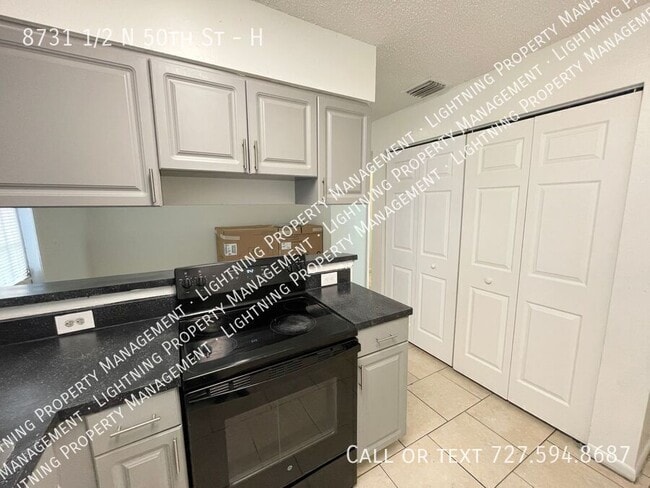 Building Photo - 8731 1/2 N 50th St-H