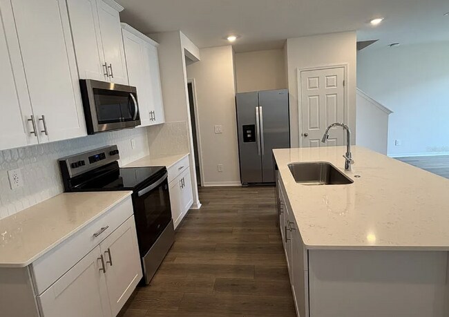Building Photo - "Spacious 3-Bedroom Townhouse with Granite Elegance in St. Cloud – 4543 Rangeland Way"