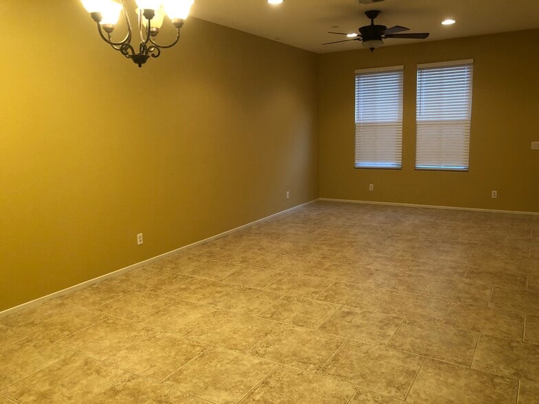 Living room area l, tile flooring ,ceiling fans ,new paint . - 6395 Delgado Ln