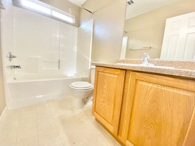 Building Photo - OVELY  2 BED ROOM 2 BATHROOM TOWNHOES LOCATED IN A GATED COMMUNITY IN HENDERSON