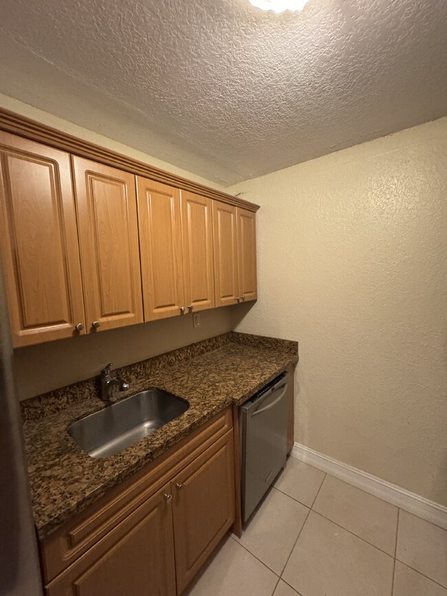 Building Photo - "Charming 1-Bedroom Condo Retreat with Stu...