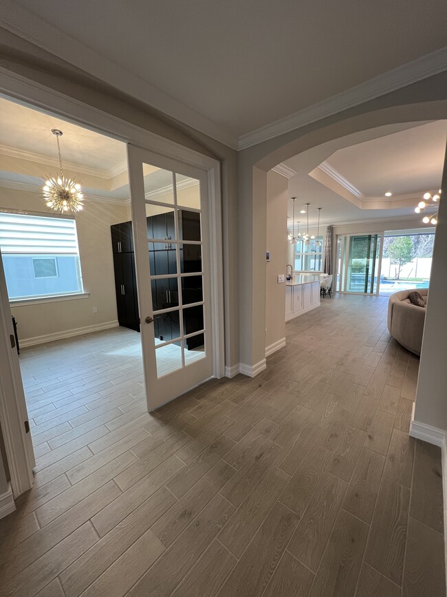 Hallway with open blinds in living room - 540 Polihale Way