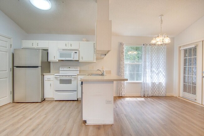 Building Photo - Northeast Pensacola 2 R, 2BA Home Near UWF with Wood-Look Flooring, Large Sunroom, Spacious Lot &...
