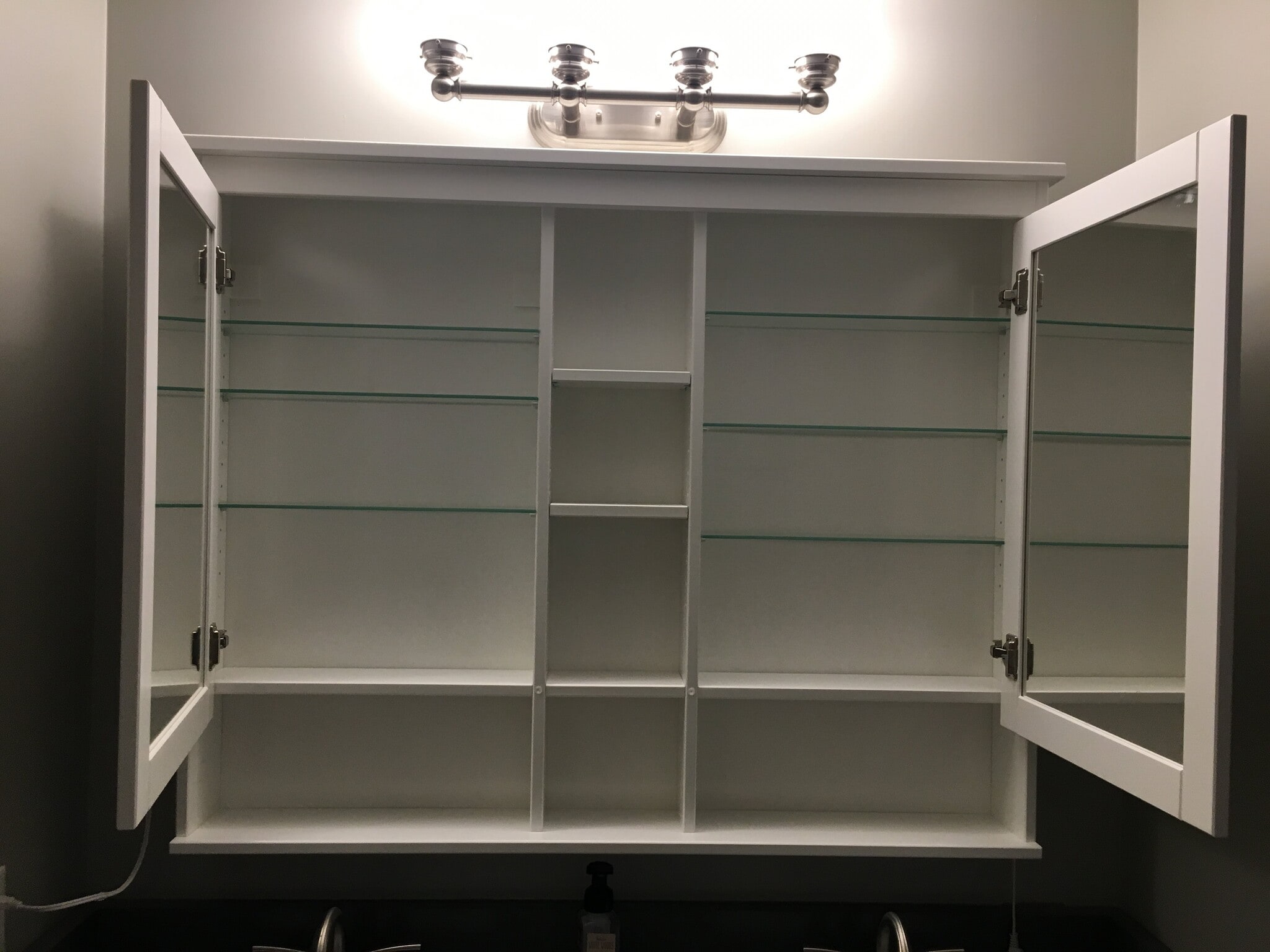 Storage cabinet in primary bathroom - 1627 Nassau Blvd