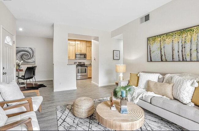 Building Photo - Beautiful & spacious 1 bedroom  updated condo with private patio and covered parking.