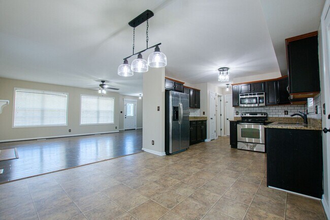 Building Photo - Pet Friendly Three Bedroom with Bonus!