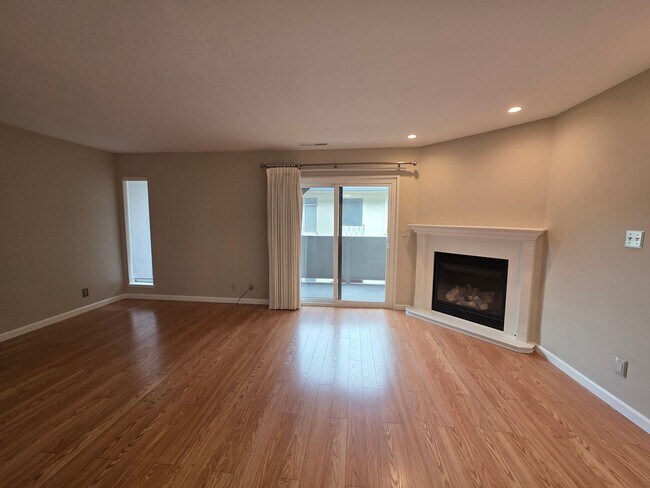 Building Photo - Spacious 2BR Condo with Central A/C, Bonus Room & Huge Storage – Walk to Burlingame Avenue