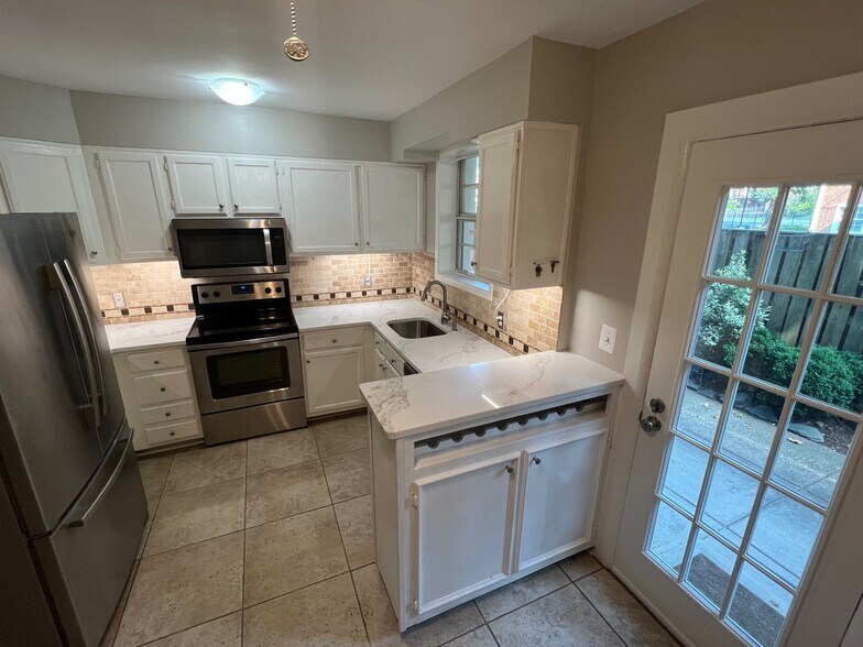 Updated bright kitchen with built in wine bar and counter - 2507 S Walter Reed Dr