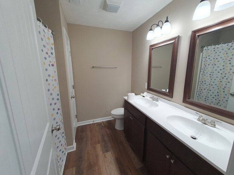 Upstairs bathroom with double vanity sinks - 406 Hedgemont Ave