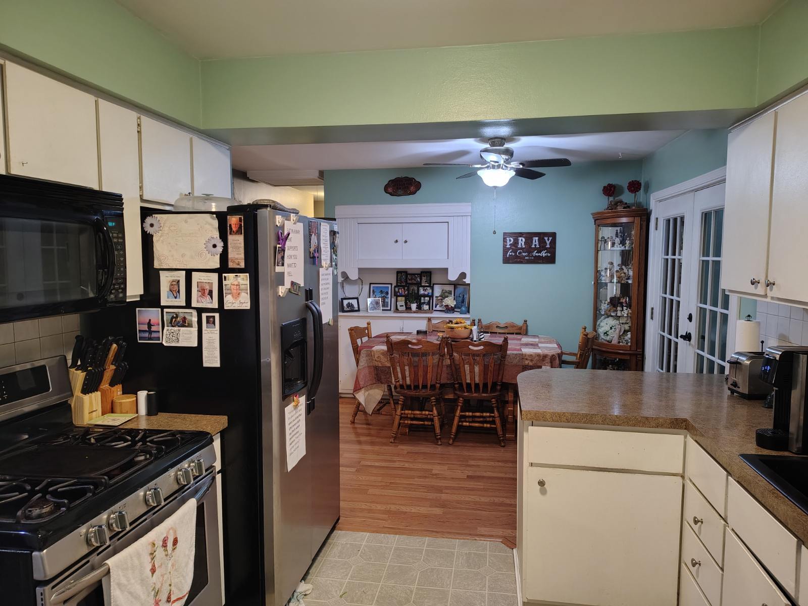 Kitchen and dining area with appliances available for use. - 8596 Meadowbrook Dr
