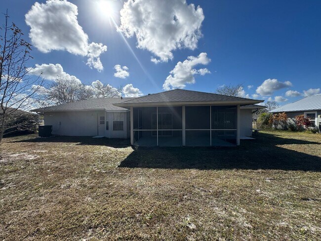 Building Photo - Spacious 3/2 Home with Screened Patio and Large Yard *Lawn Care Included!*