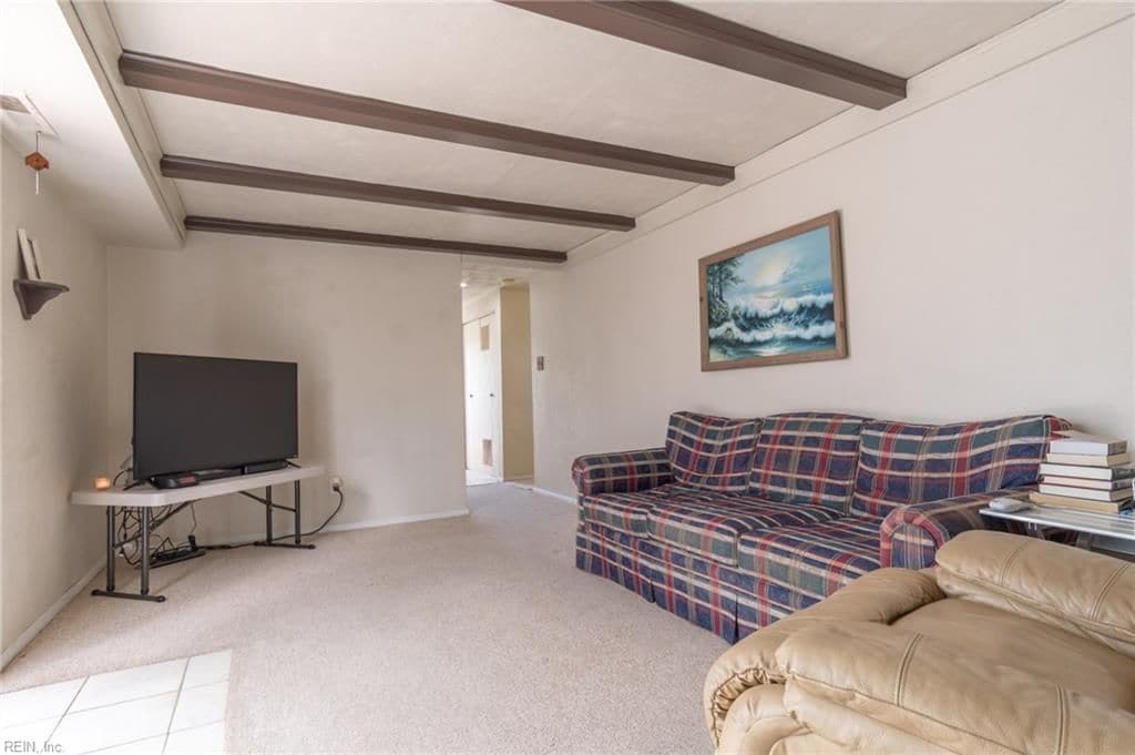 Carpet was removed, this room had concrete underneath the carpet, so vinyl flooring is being installed - 301 Pepper Mill Ct